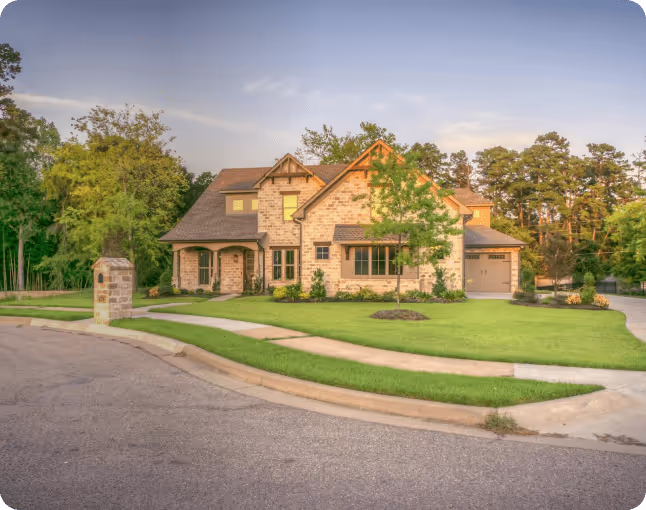 House front with trees surrounding
